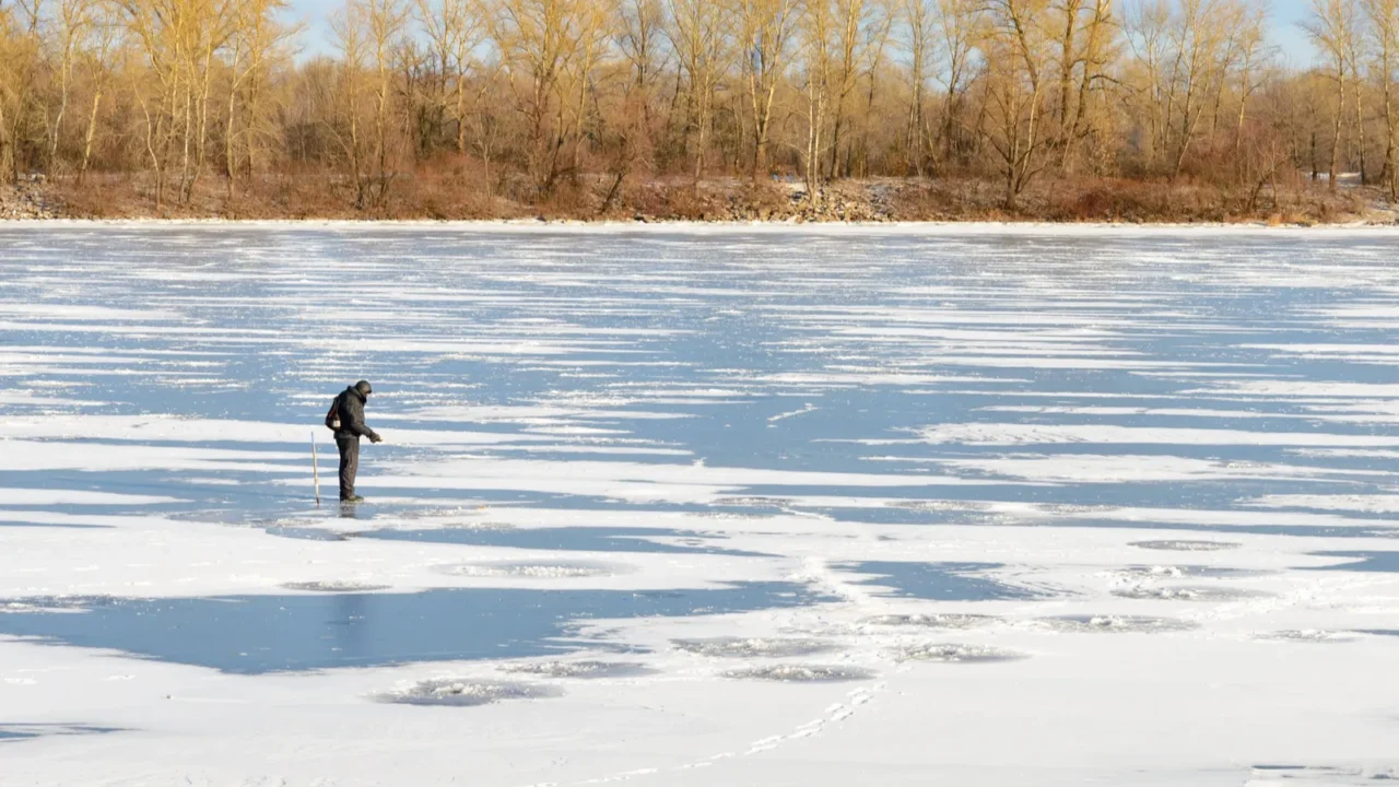 fisherman on the frozen river