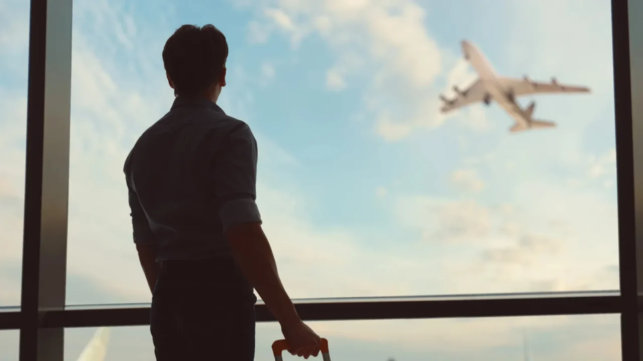 go on an adventure young man looking at a plane