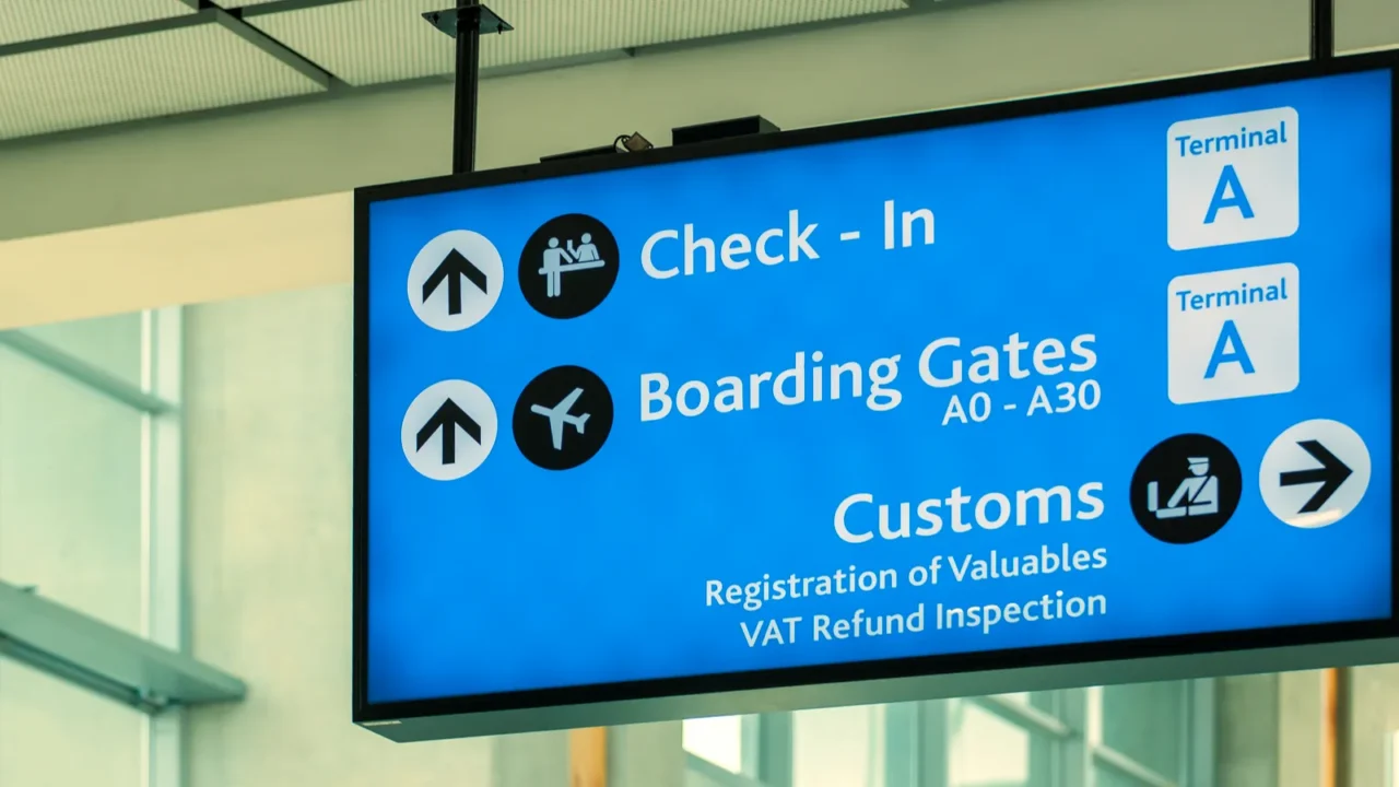 info sign at international airport  directions for check in