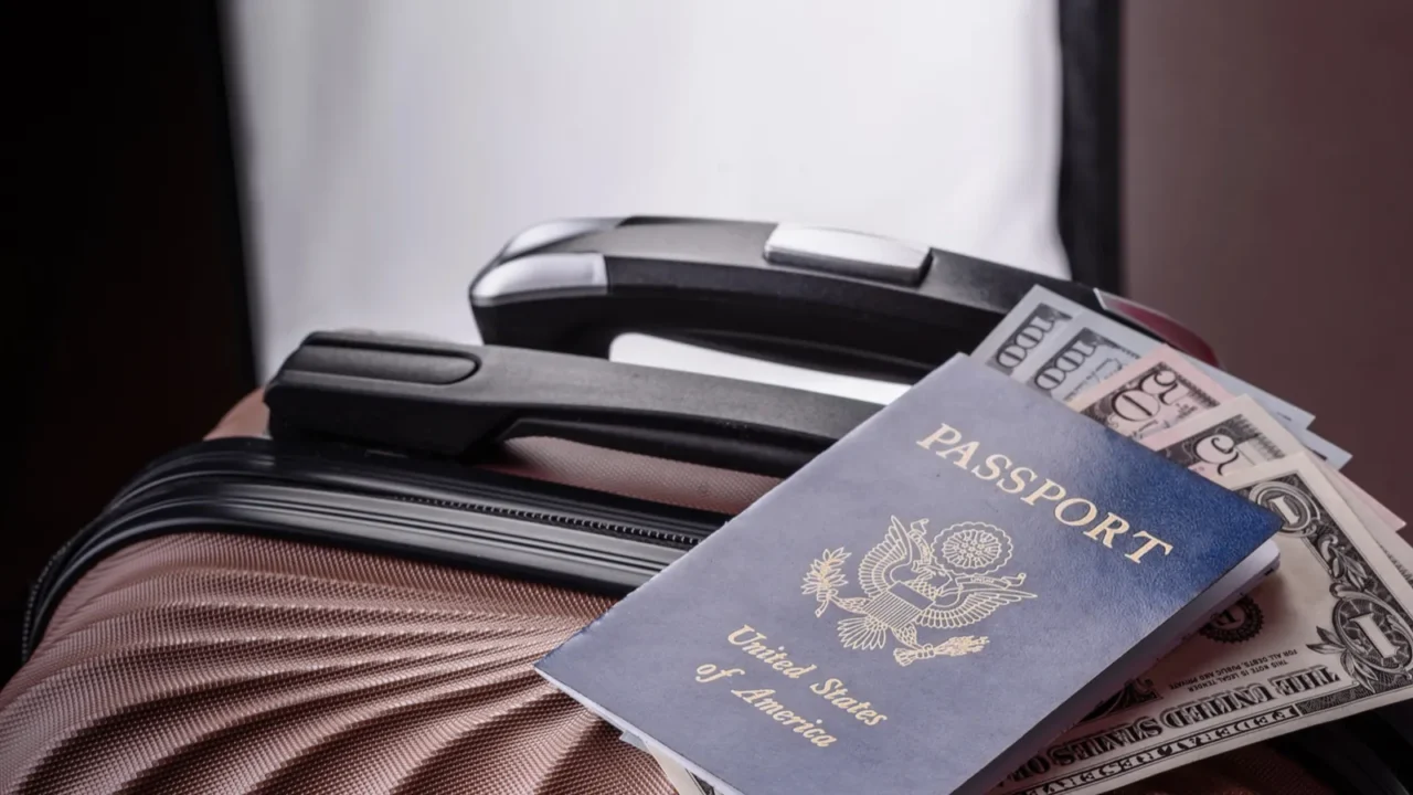 international passport of a usa citizen on a suitcase departure