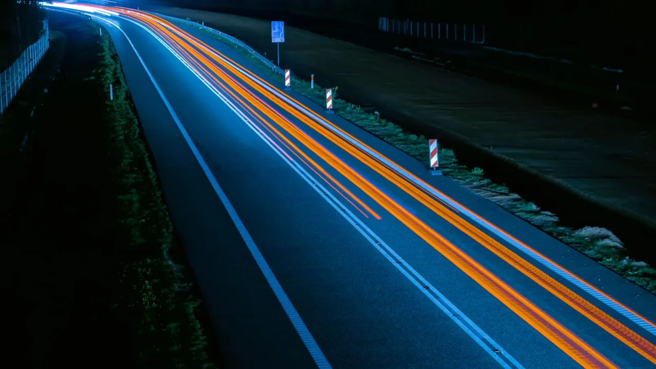 lights of cars driving at night long exposure