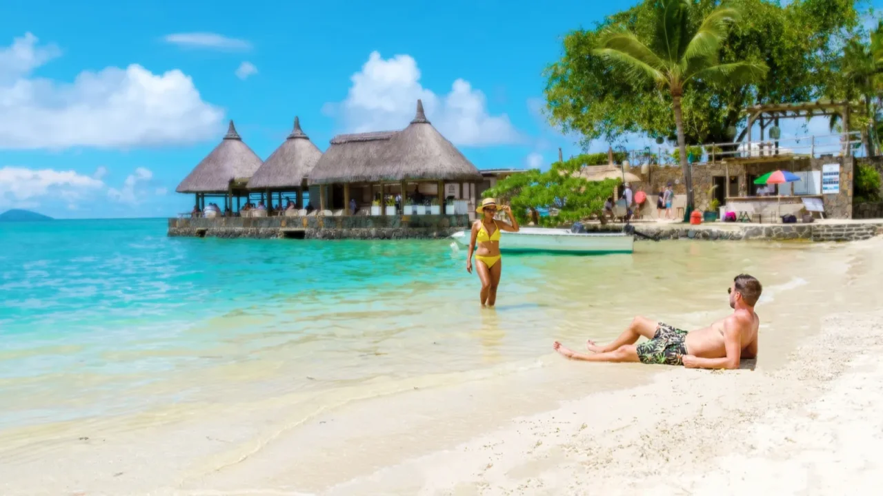 man and woman on a tropical beach in mauritius a