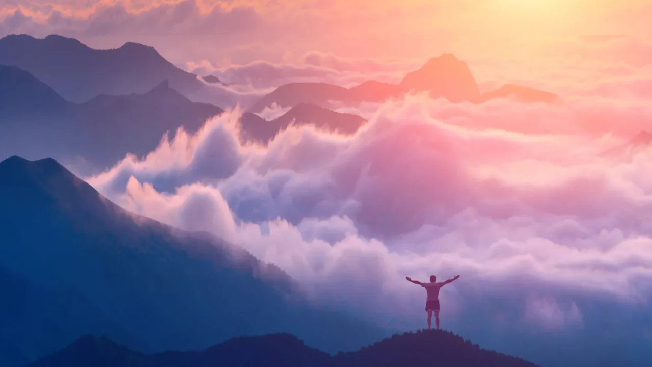 man standing on a mountain top