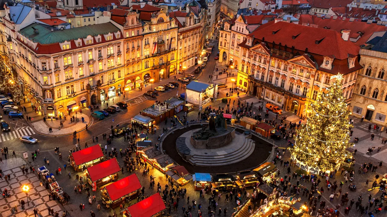View from above on traditional Christmas market at Old Town Square illuminated and decorated for holidays in Prague.