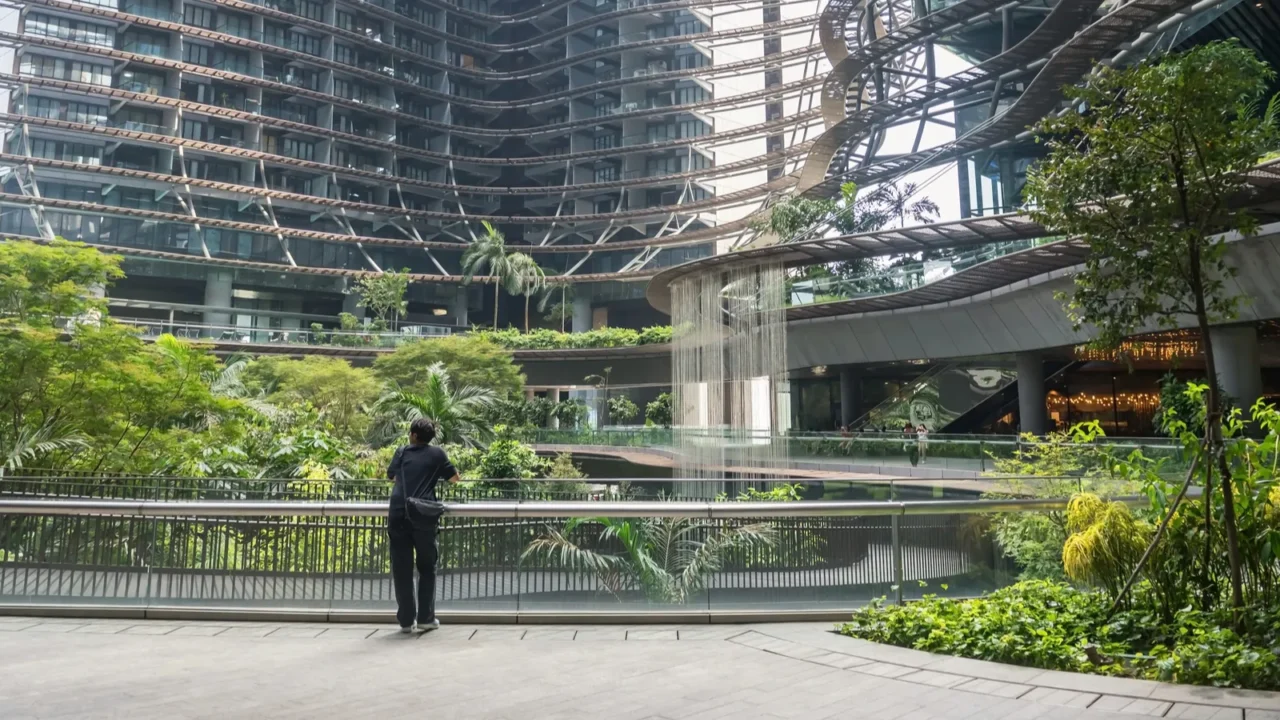 people at beautiful garden interior in modern building with uphill