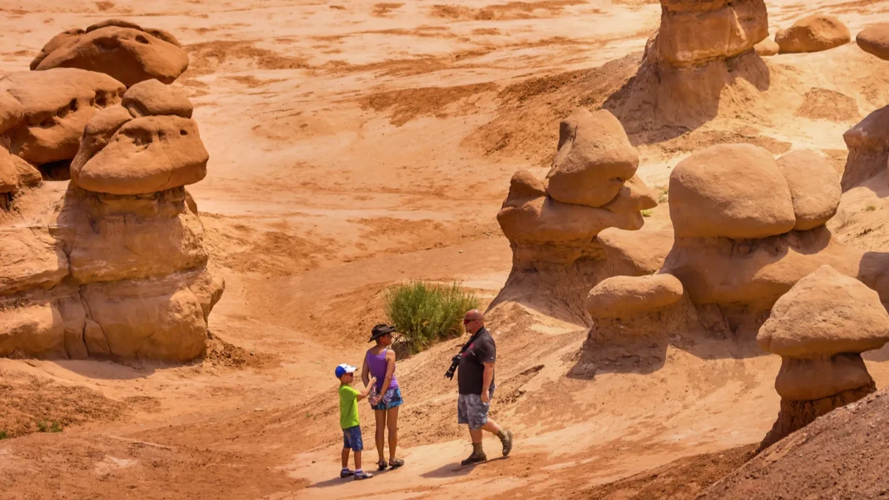 people walk among the goblins mushroon shaped hoodoos goblin val