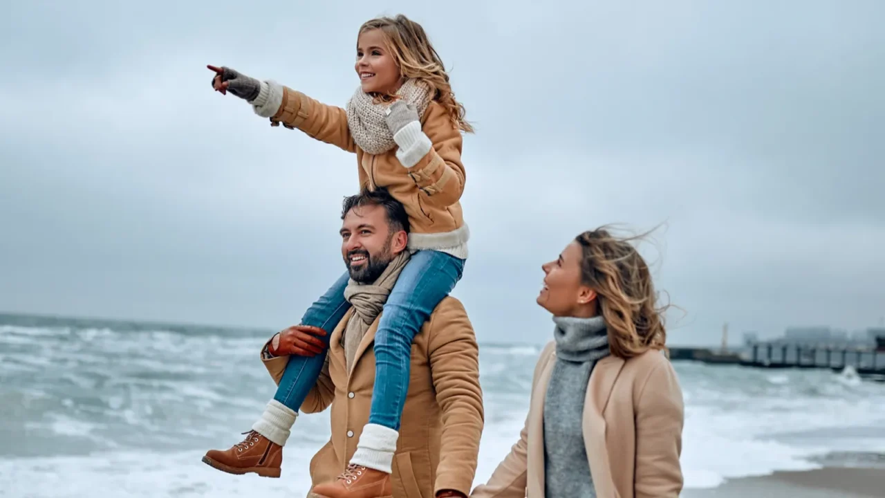 portrait of a young married couple and their cute daughter