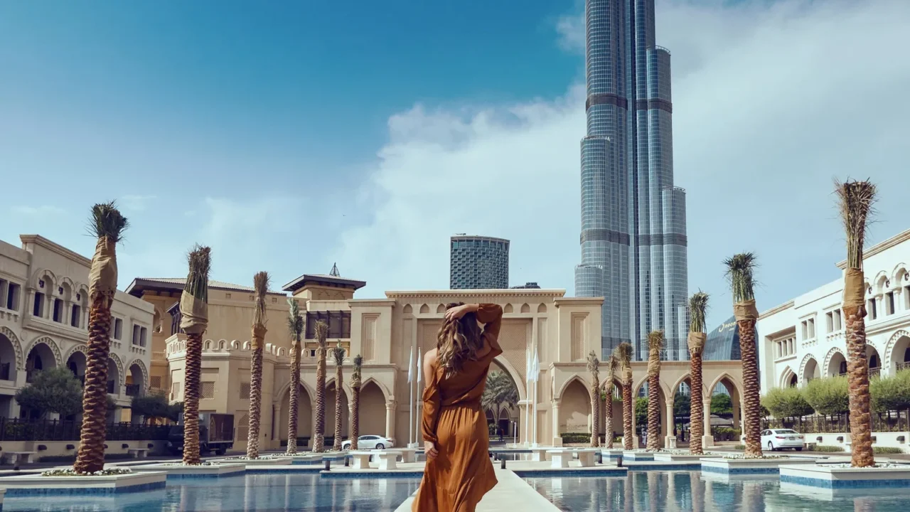 portrait of beautiful woman wearing long dress walking in dubai