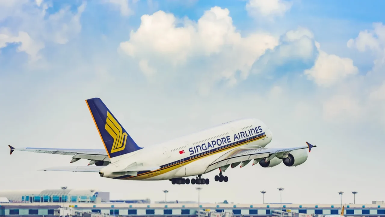 singapore airlines plane taking off at airport