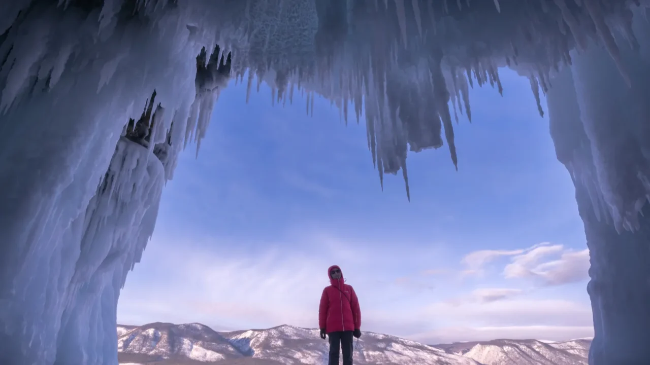 skater rides on the baikal ice the view from the