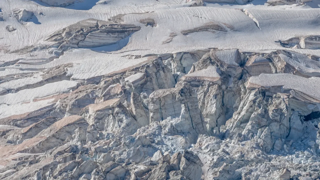spectacular glacier unfolds under light showing its crevices and its