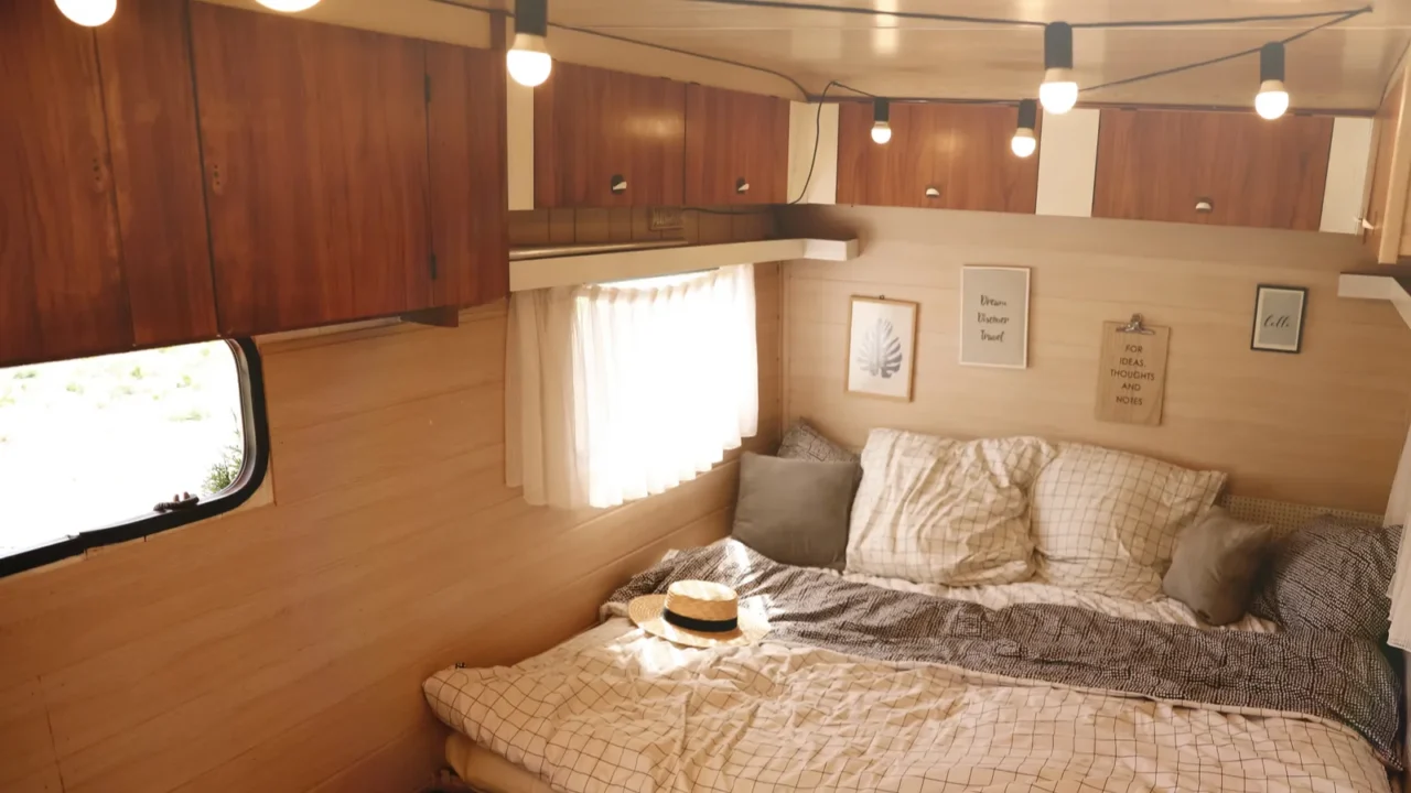 stylish room interior with comfortable bed and pillows in modern