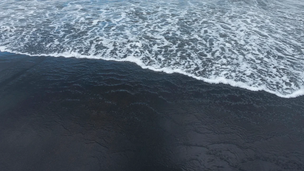 the famous black sand of bali seseh beach indonesia located