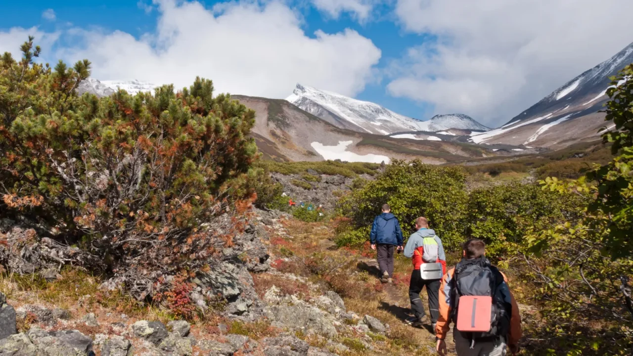 tourists hiking at dzenzur volcano nalychevo nature park kamchatka krai