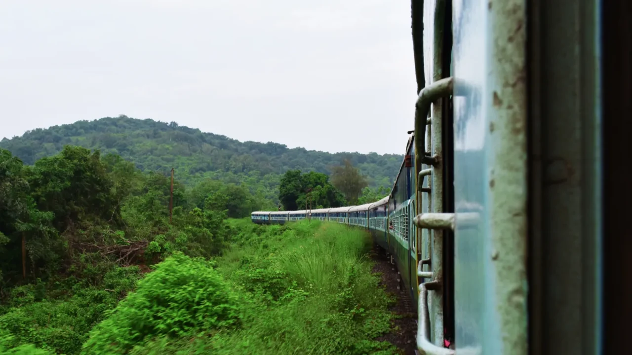 train crossing meadows in a hilly railroad with a motion