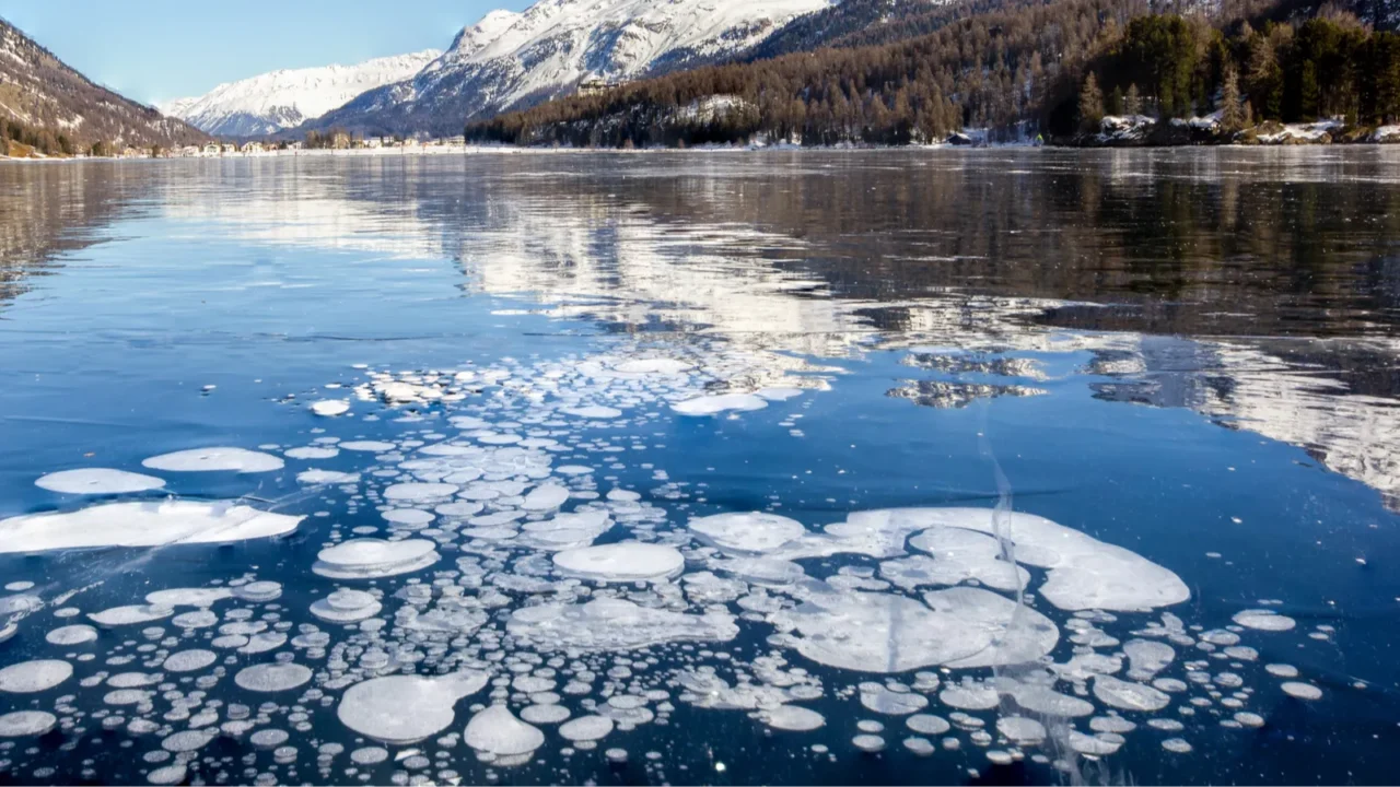 trapped methane bubbles under the frozen lake with landscape as