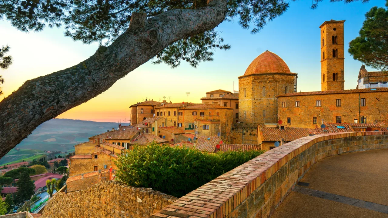 tuscany volterra town skyline church and trees on sunset ital