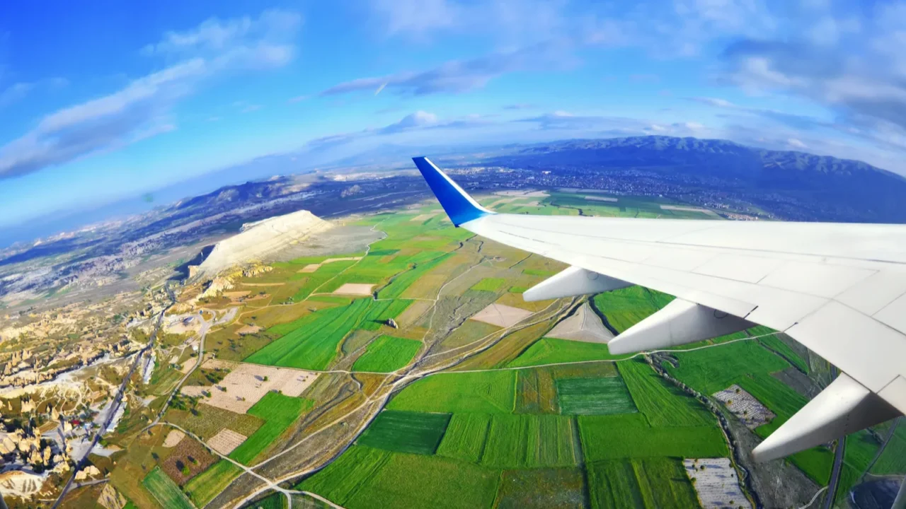 view from airplane window on fields and mountains cappadocia