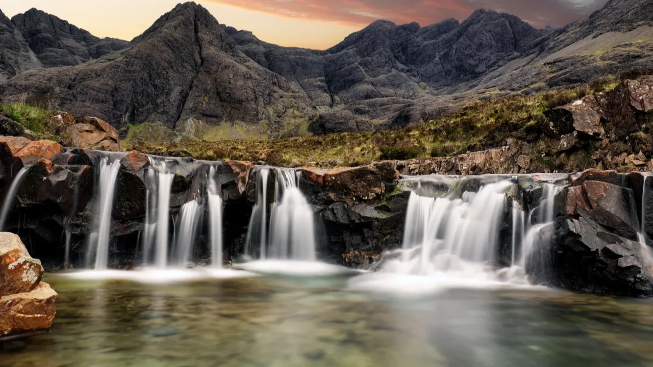 waterfall at sunset in scotland fairy pools