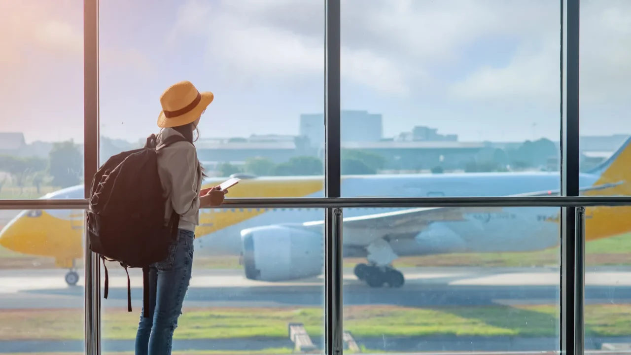 woman passenger tourist or traveller in late delay checking in