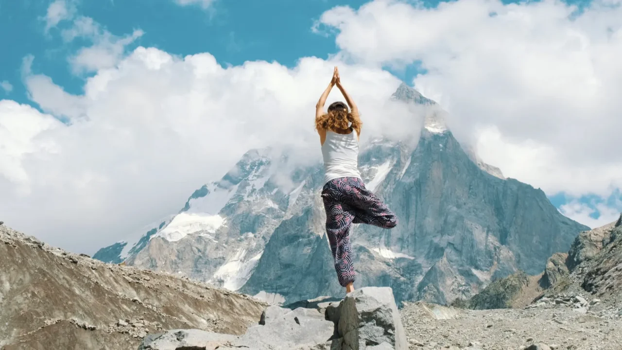woman performs an basic asana tree  vriksasana in yoga