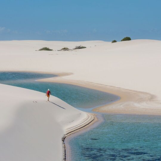 Brazil’s lagoon-filled desert where visitors hike barefoot between dunes
