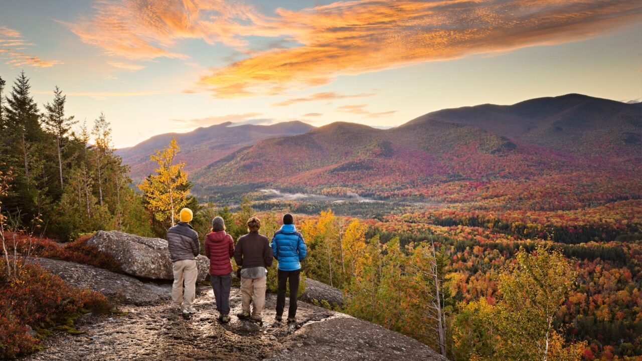 group of hikers enjoying the view in the Adirondacks