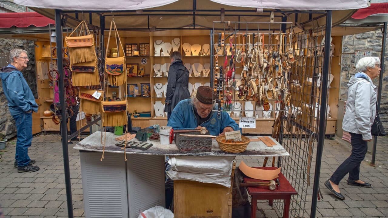 Quebec, Canada September 23, 2018: street artisan on the historic street of Quebec City, Rue Petit Champlain street for tourists.