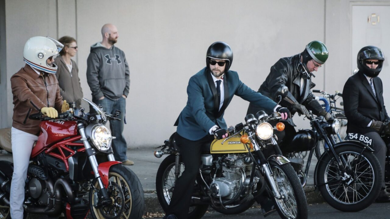 PORTLAND, OR - CIRCA SEPTEMBER 2016: A group of men get ready to join the annual Distinguished Gentleman's Ride in Portland, Oregon circa September 2016 on a variety of motorcycles.