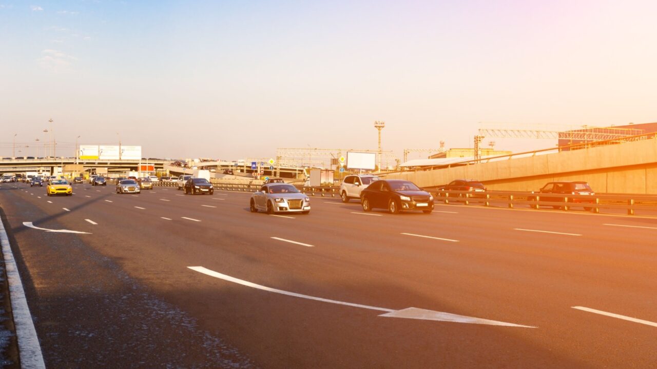 Traffic on a highway with sunlight