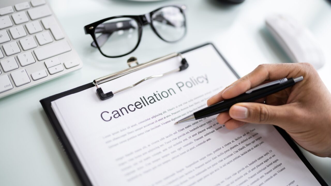 African Man Reading Business Cancel Policy And Regulation