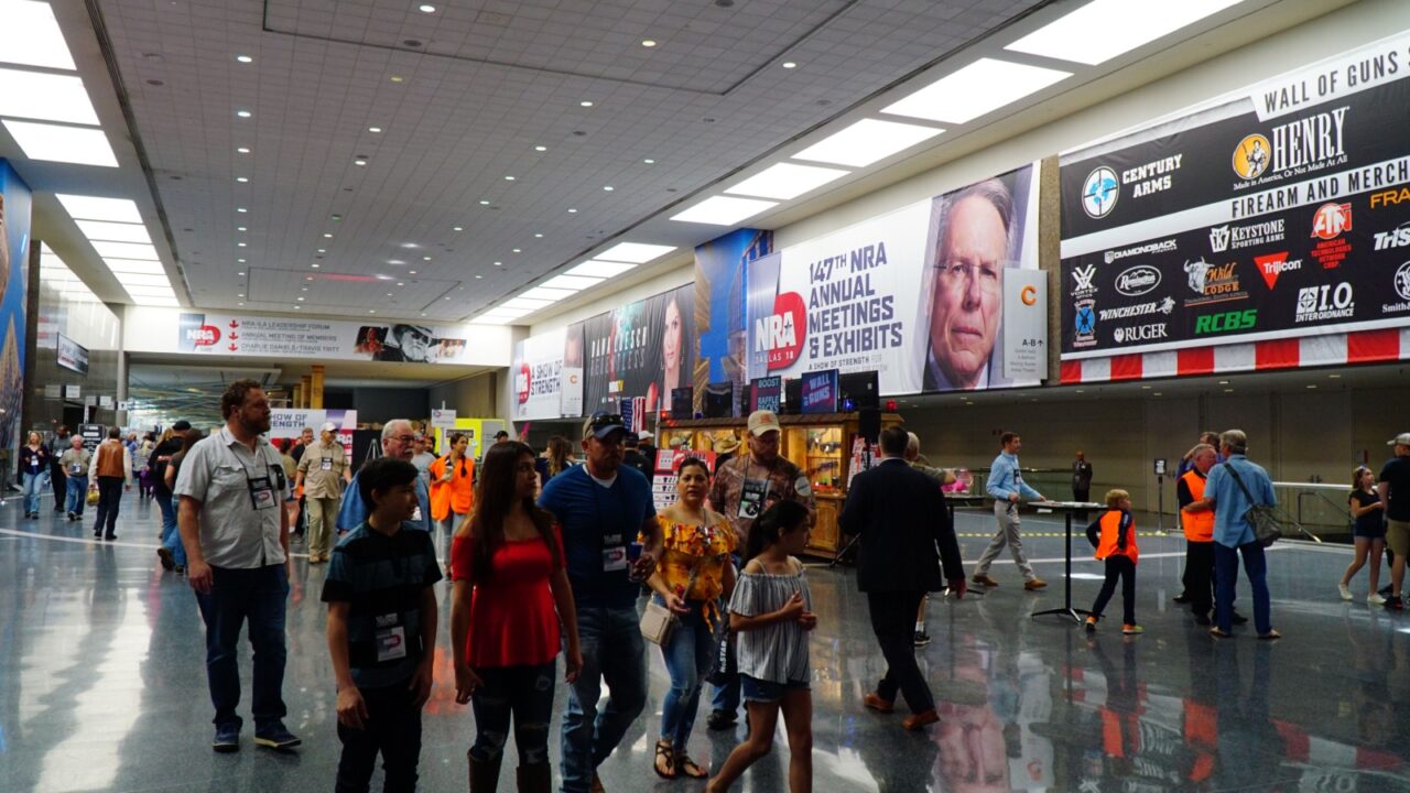 Dallas, TX / USA - 5/6/2018: A family walks the floor at the 147th NRA annual meeting held at the Kay Bailey Hutchisons convention center.