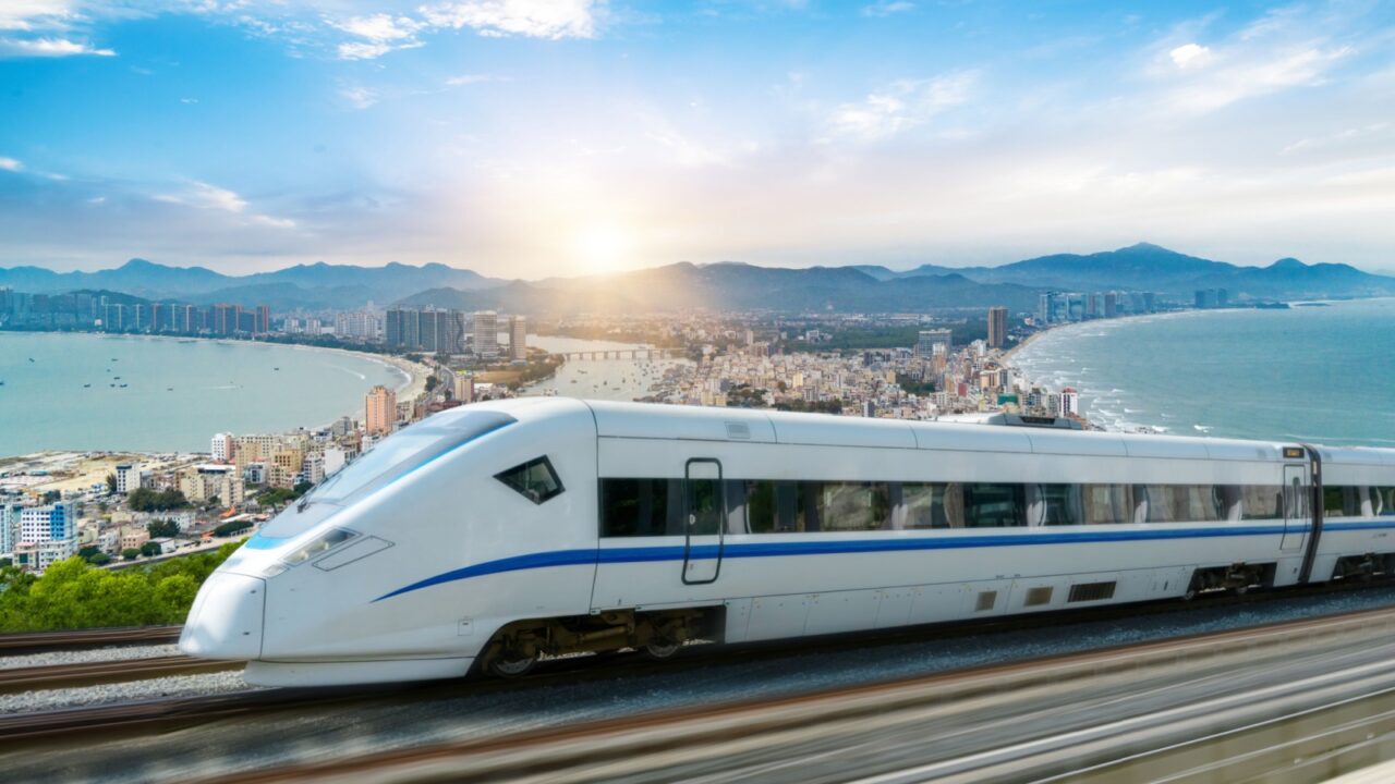 High speed trains travel in beautiful bay cities