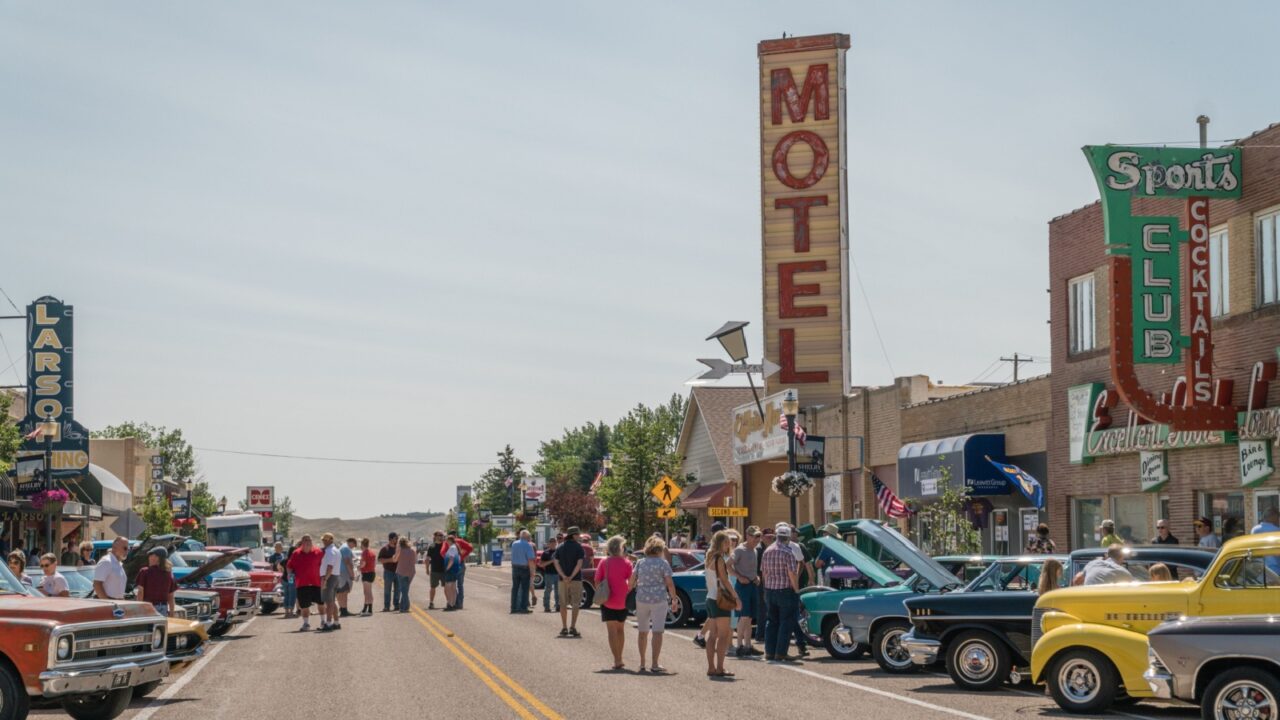 Shelby, MT, US July 10, 2021: Classic and vintage car show on Main Street in small town America attracts crowds of local residents and tourists to view rows of classic and perfectly restored vehicles