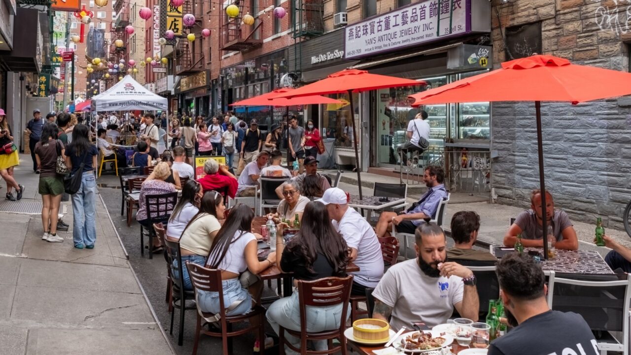 New York, USA - June 3rd 2024 - Photo showing the busy streets of Chinatown in New York City with signs in Chinese language.