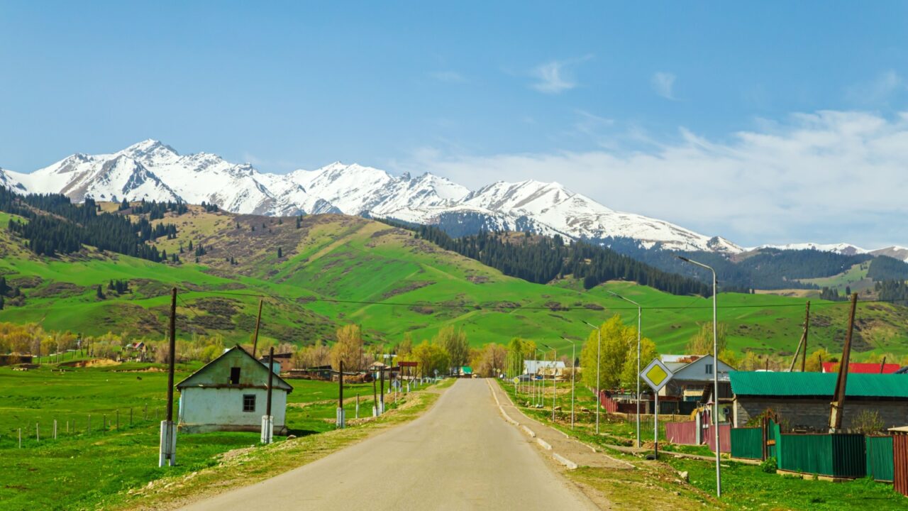 Highway in the mountains of the Trans-Ili Alatau ridge. Village and nature of Central Asia. Almaty district, Kazakhstan - May 5, 2024.