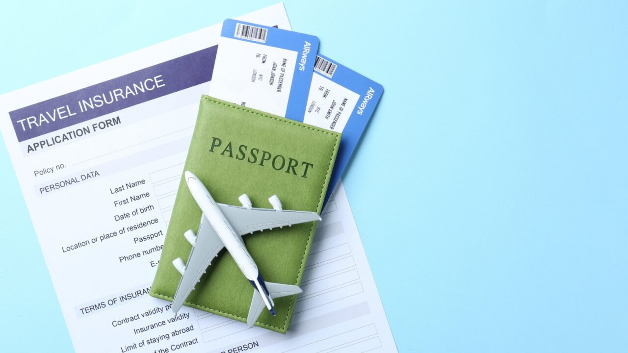 Medical tourism. Travel insurance application form, plane model, flight tickets and passport on light blue background, flat lay. Space for text