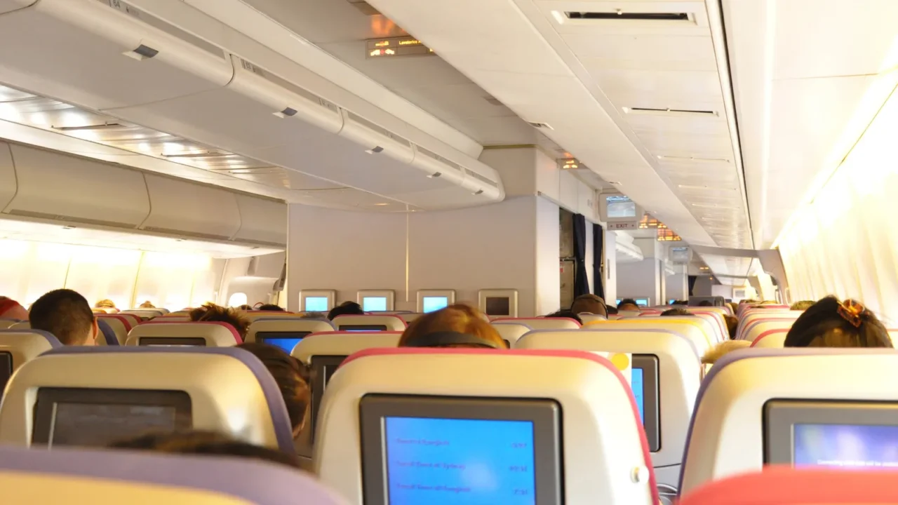 aircraft cabin interior with passengers
