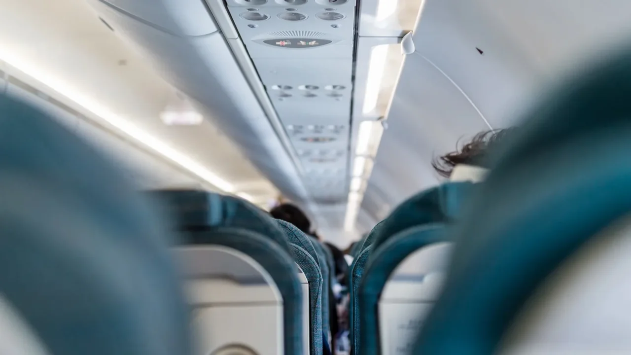 airplane cabin with people inside