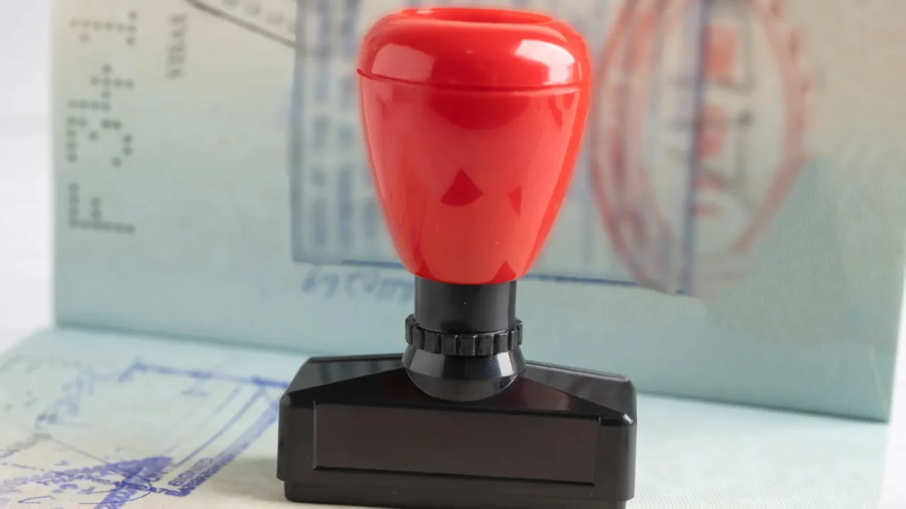 approved stamp visa and passport document to immigration at airport