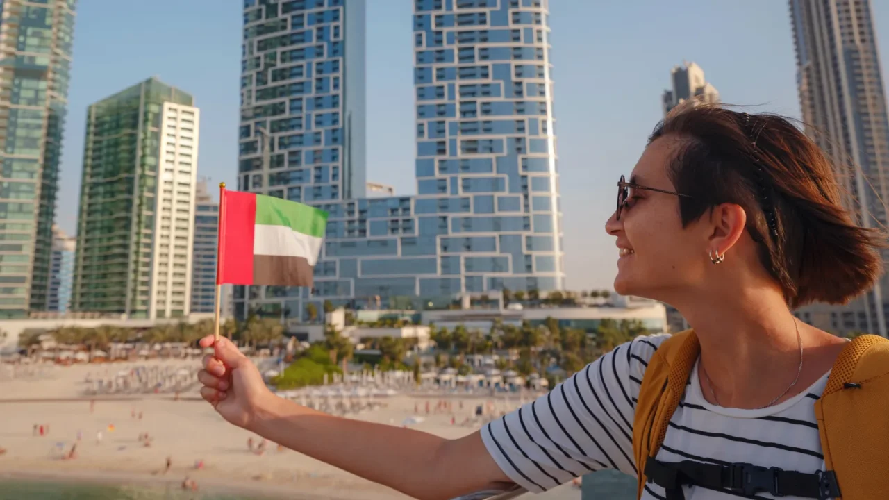 attractive traveler asian woman with yellow backgpack walking on promenade