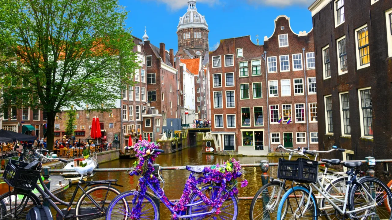 bicycles over canal amsterdam city picturesque landscape in the nitherlands
