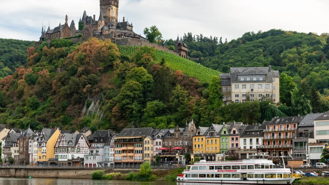breathtaking landscape featuring castle cochem towering over charming riverside houses