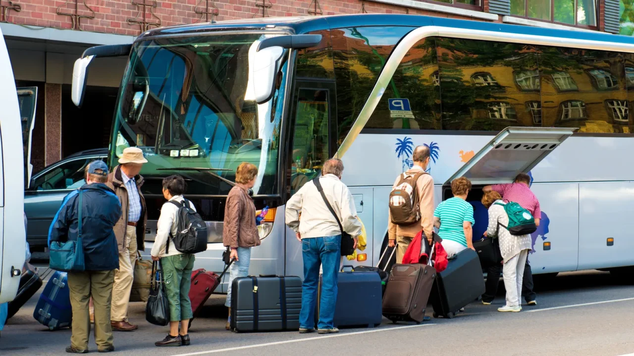 bus for tourists transportation and group of tourists