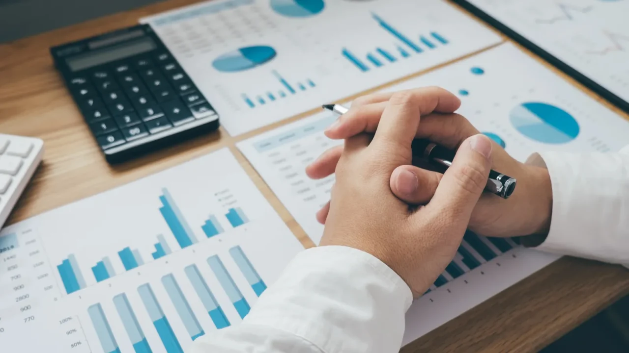 businessman working on a graph document financial report and analysis