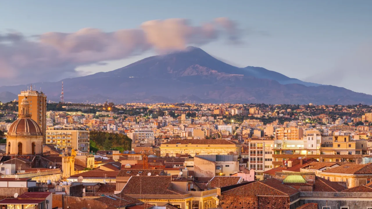 catania sicily italy skyline with mt etna at dusk