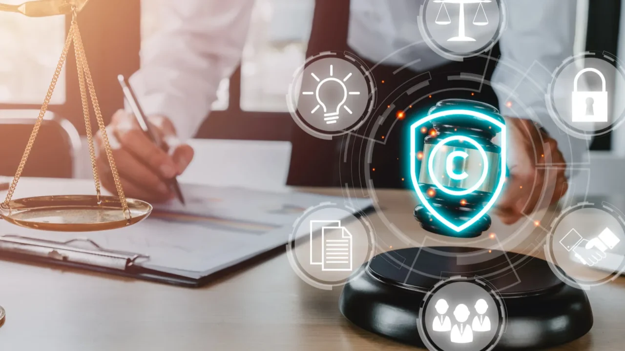 copyright or patent concept woman hand holding judge gavel on