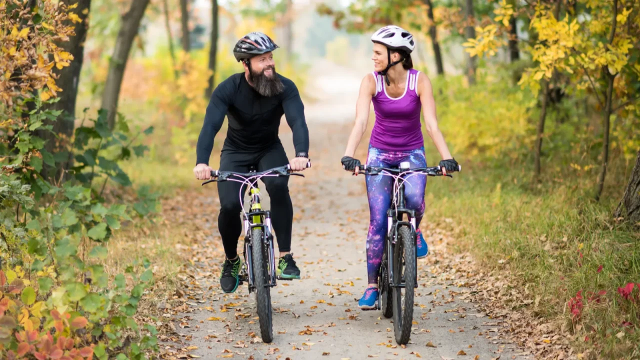 couple cycling outdoors