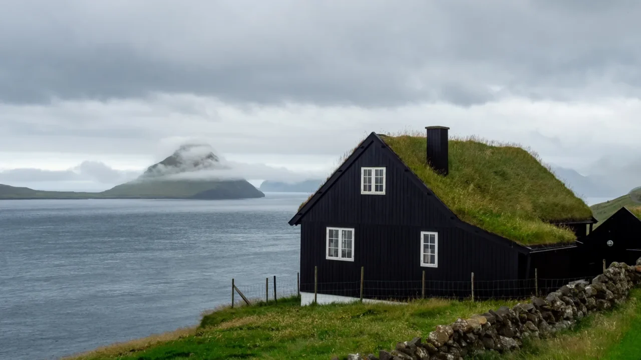 faroe islands house with grass roof on the slope of