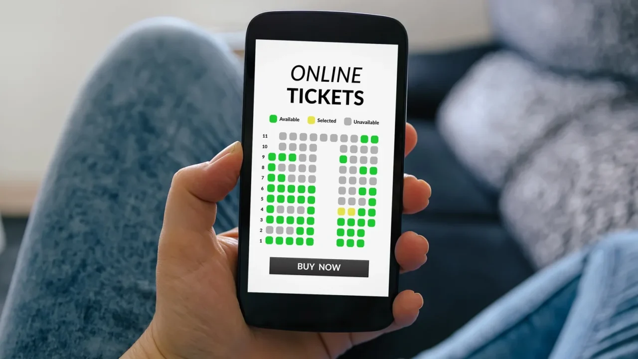 girl holding smart phone with online tickets concept on screen